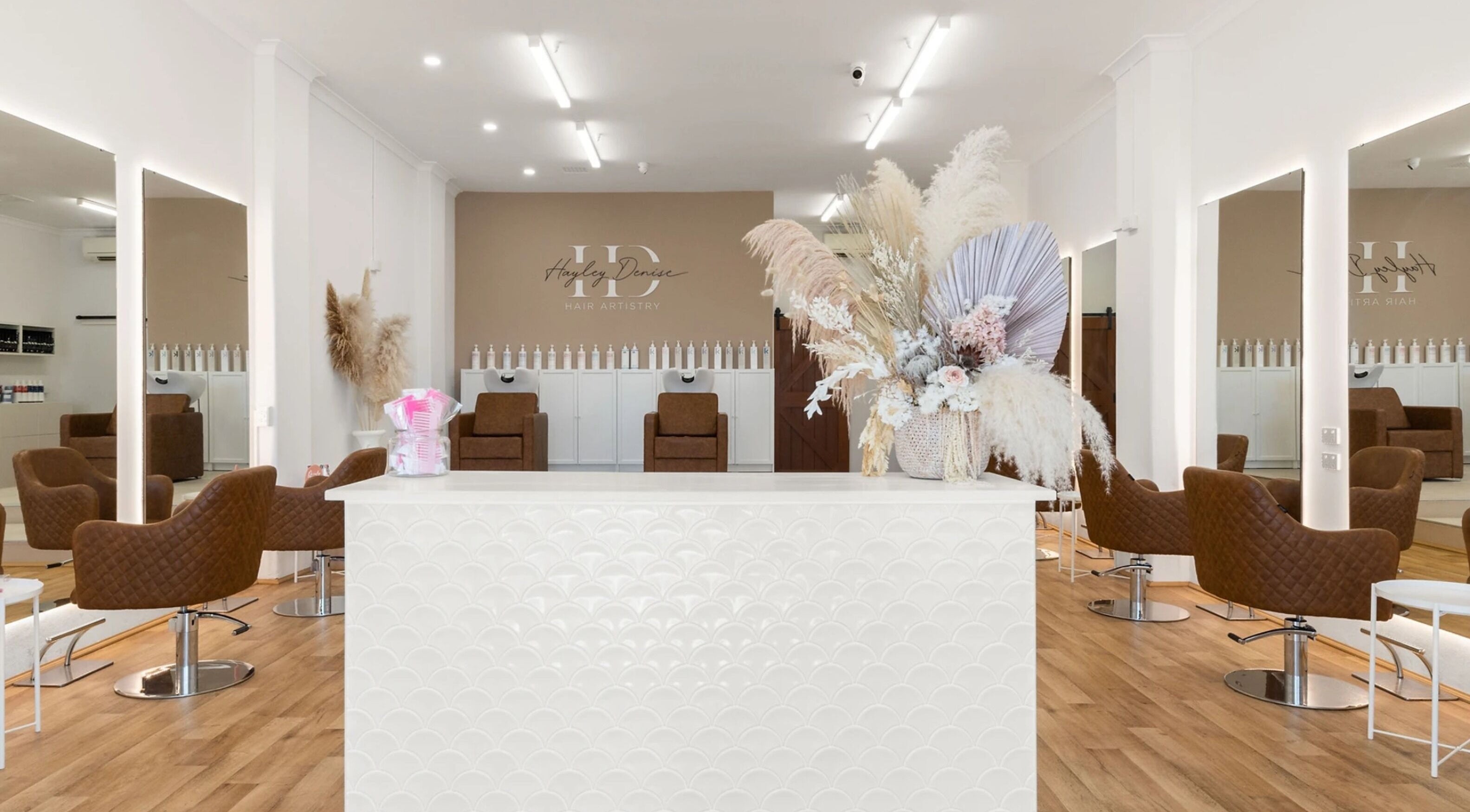 Spacious and modern interior of HD Hair Artistry in Yokine, Western Australia, AU with stylish decor and seating.
