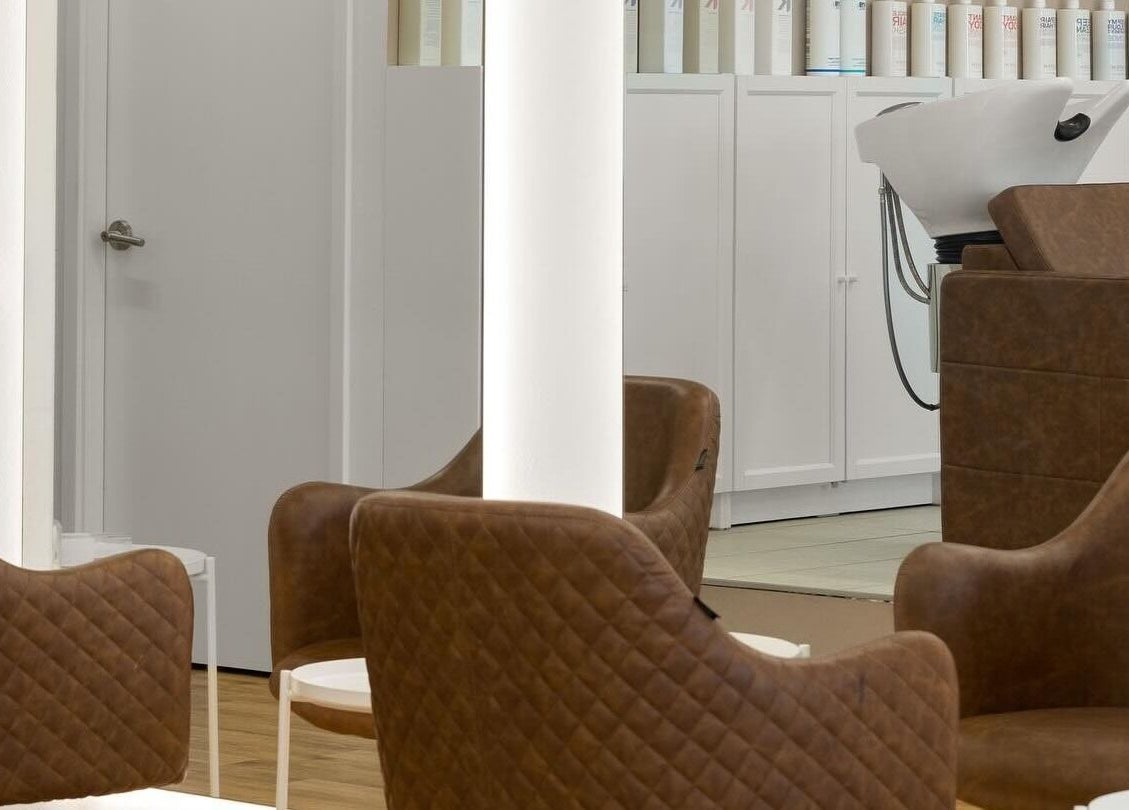 Luxurious seating area at HD Hair Artistry in Yokine, Western Australia, AU featuring chic salon chairs.