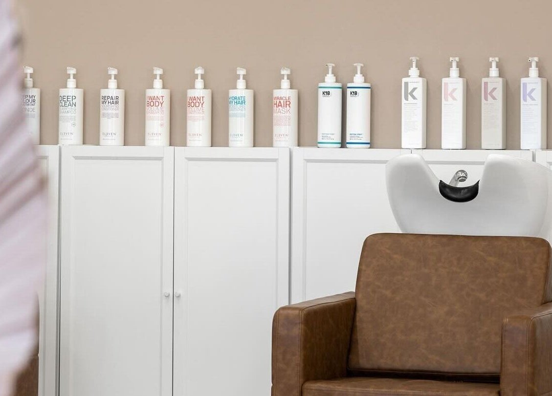 Stylish hair washing station at HD Hair Artistry in Yokine, Western Australia, AU with premium products lined up.