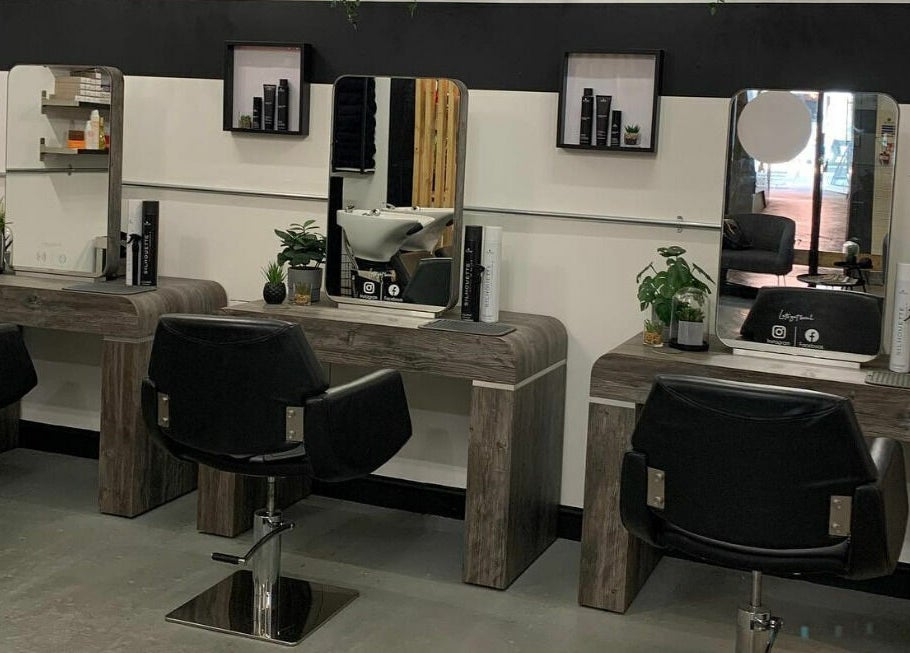 Modern salon setup at Eden, Sheffield, England, GB with sleek chairs and mirrors for beauty treatments.