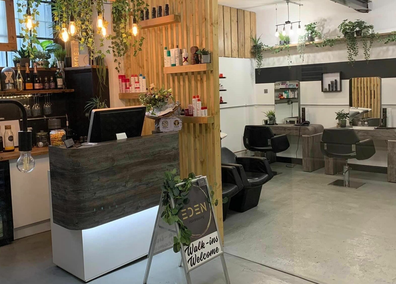 Interior of Eden beauty salon in Sheffield, England, GB featuring elegant decor and welcoming styling stations.