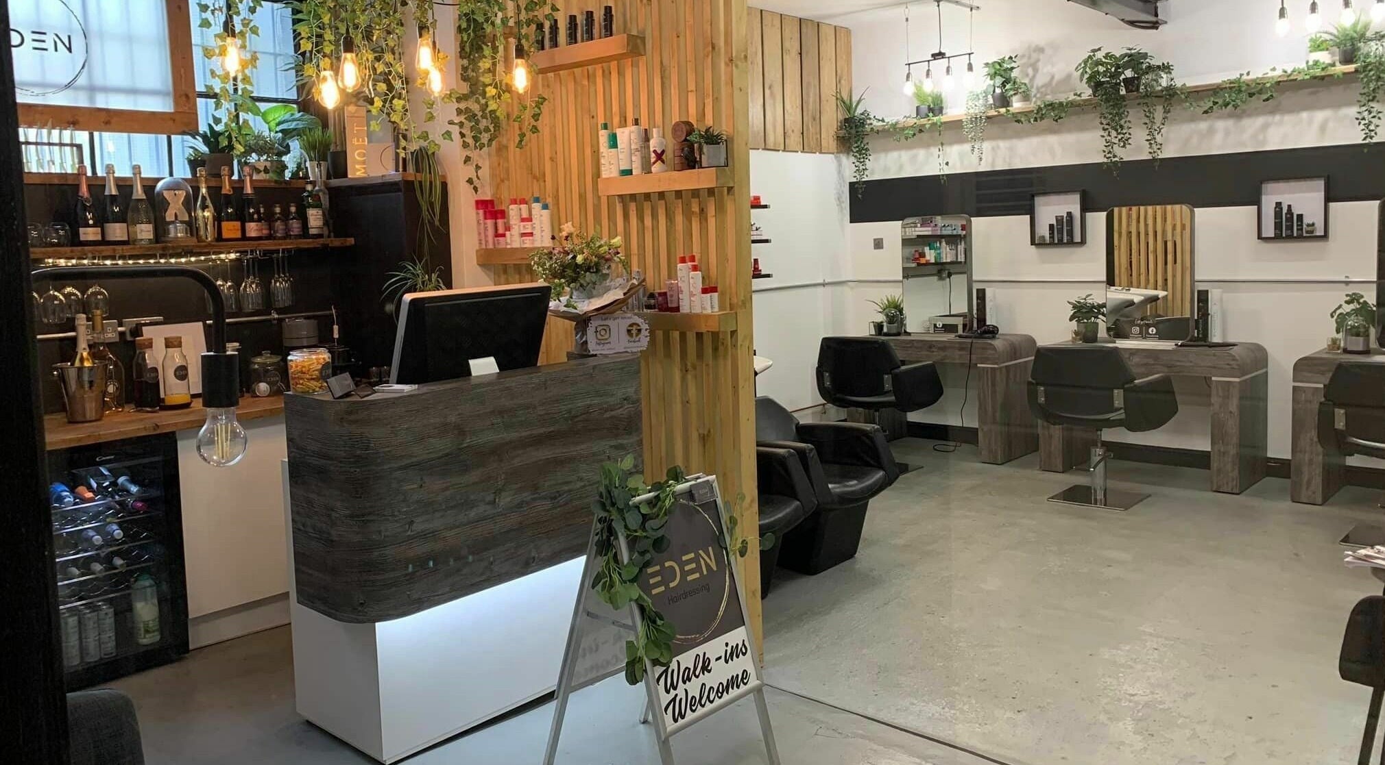 Interior of Eden beauty salon in Sheffield, England, GB featuring elegant decor and welcoming styling stations.