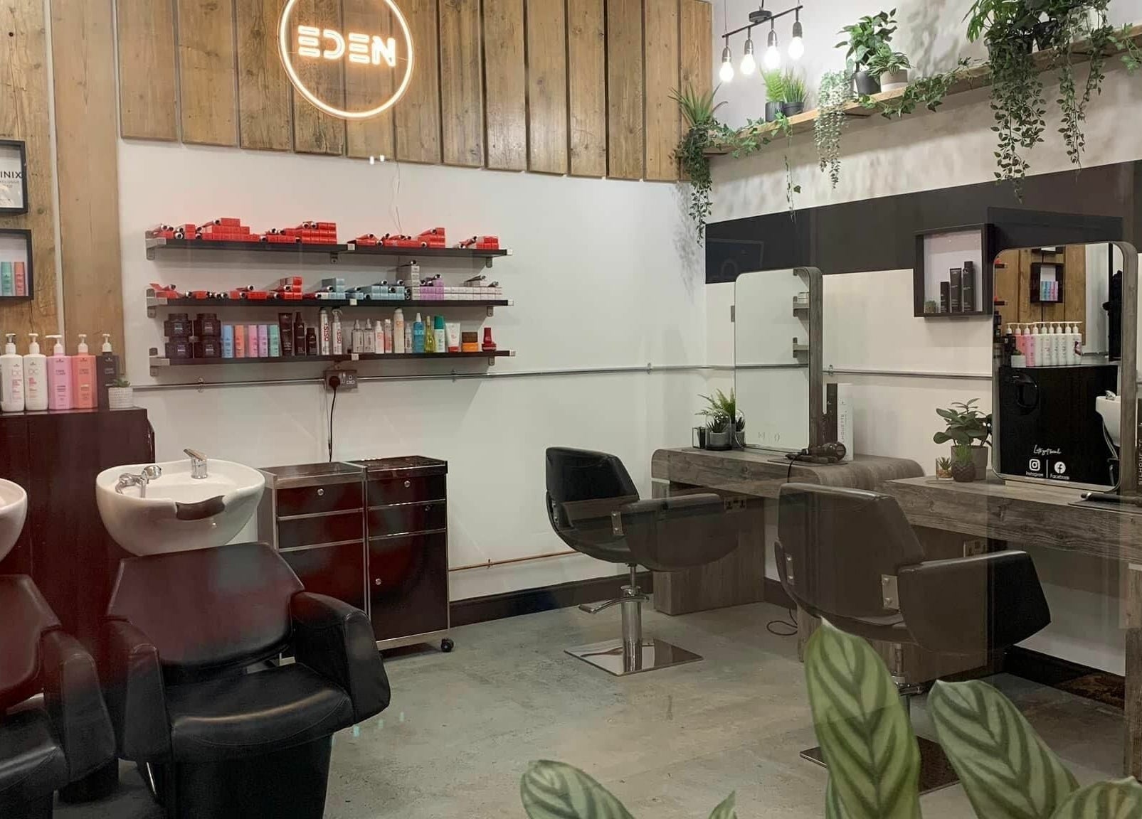 Chic interior of Eden salon in Sheffield, England, GB with stylish chairs, mirrors, and beauty products.