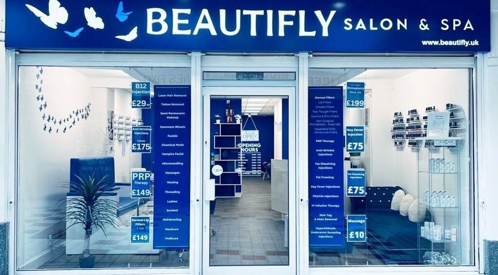 Beautifly salon in Romford, England, GB, showcasing stylish entrance with beauty service details on display.