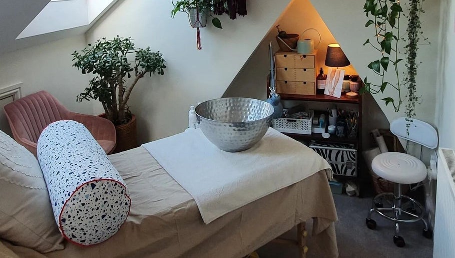 Spa treatment room at Holistic Bristol, Bristol, United Kingdom, GB, featuring massage bed and tranquil decor.