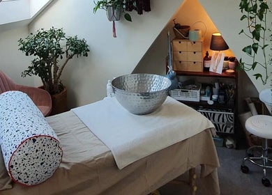 Spa treatment room at Holistic Bristol, Bristol, United Kingdom, GB, featuring massage bed and tranquil decor.
