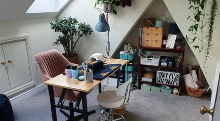 Cozy workspace in Holistic Bristol, Bristol, United Kingdom, GB adorned with plants and wellness setup.