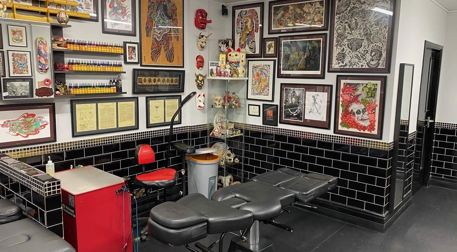 Colorful tattoo artwork and piercing space at Electric Punch Piercing, Hoddesdon, England, GB.