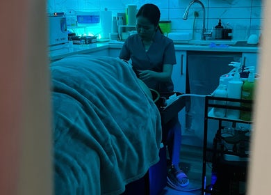 Calm spa treatment room at Skin4Life Beauty Bar, Calgary, Alberta, CA. Aesthetician prepares for a soothing session.