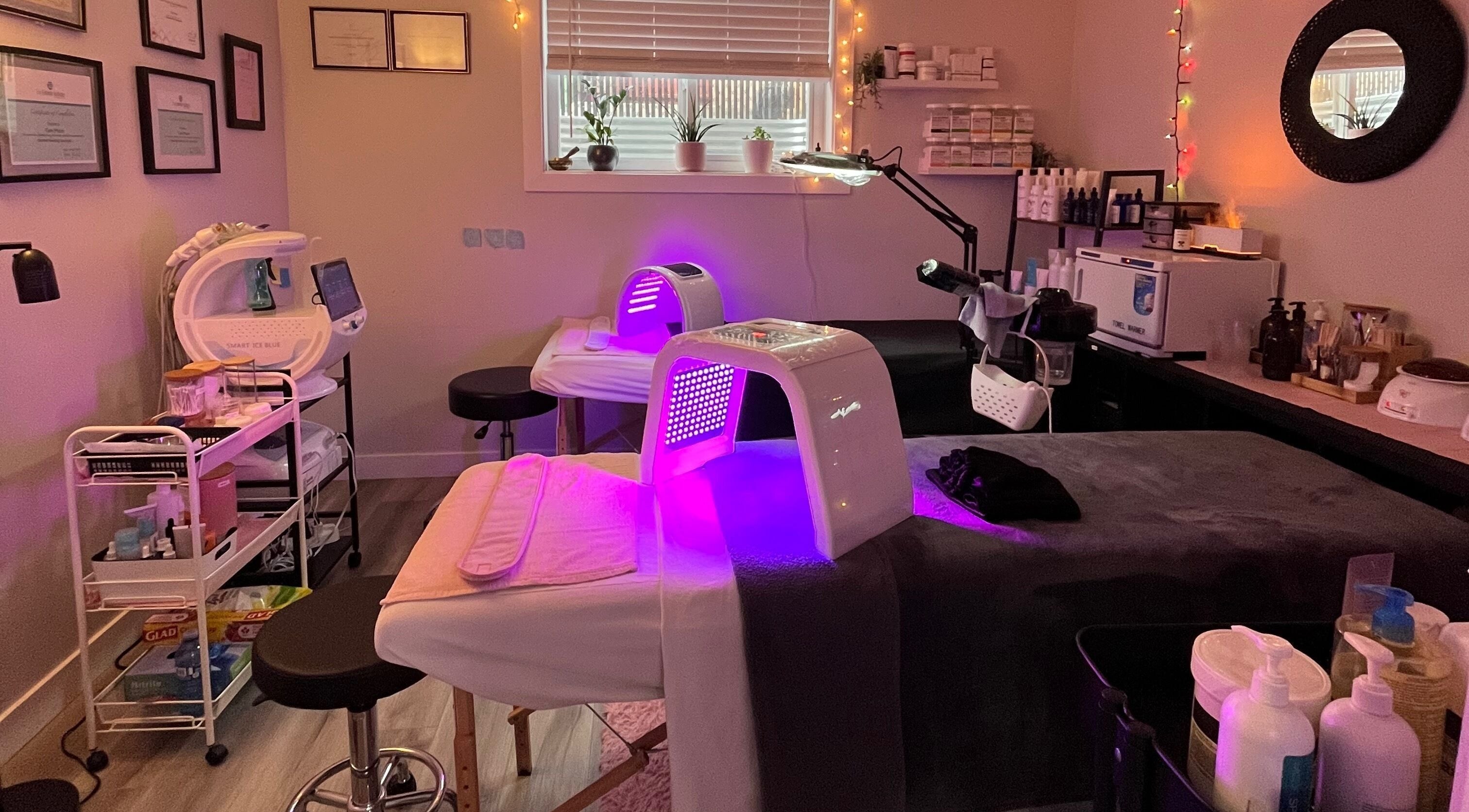 Modern treatment room with glowing light therapy at Skin4Life Beauty Bar, Calgary, Alberta, CA.
