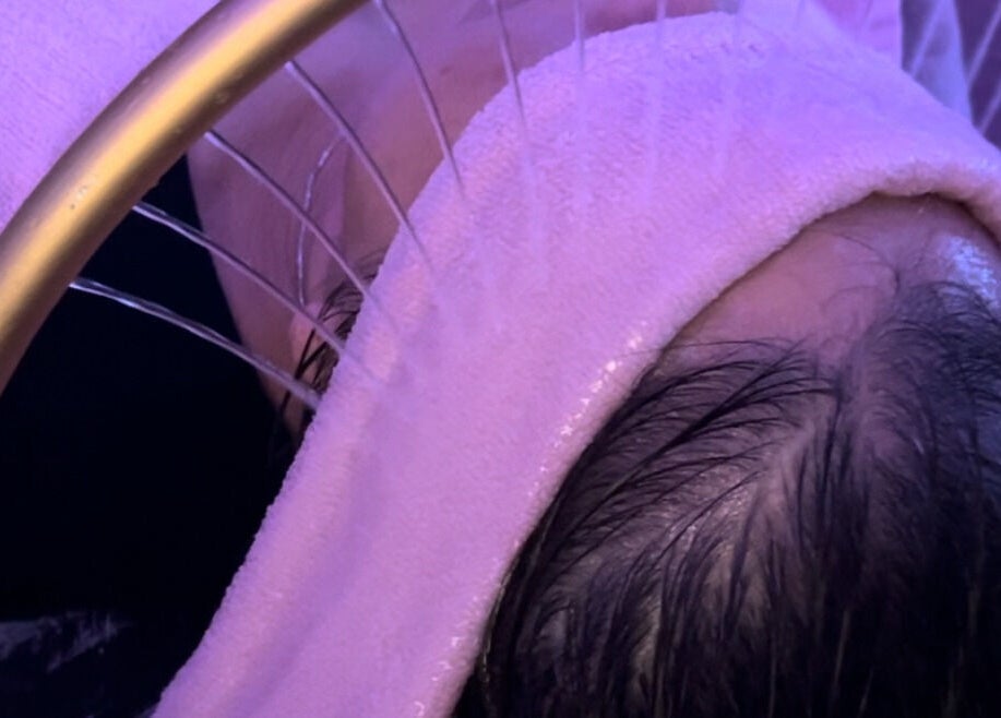 Facial steam treatment at Skin4Life Beauty Bar, Calgary, Alberta, CA. Client wrapped in a cozy towel.