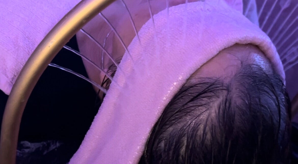 Facial steam treatment at Skin4Life Beauty Bar, Calgary, Alberta, CA. Client wrapped in a cozy towel.