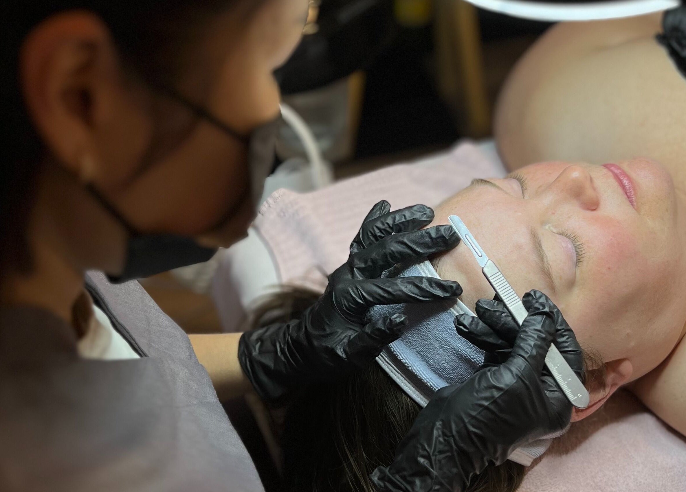 Professional dermaplaning at Skin4Life Beauty Bar, Calgary, Alberta, CA enhancing skin radiance.
