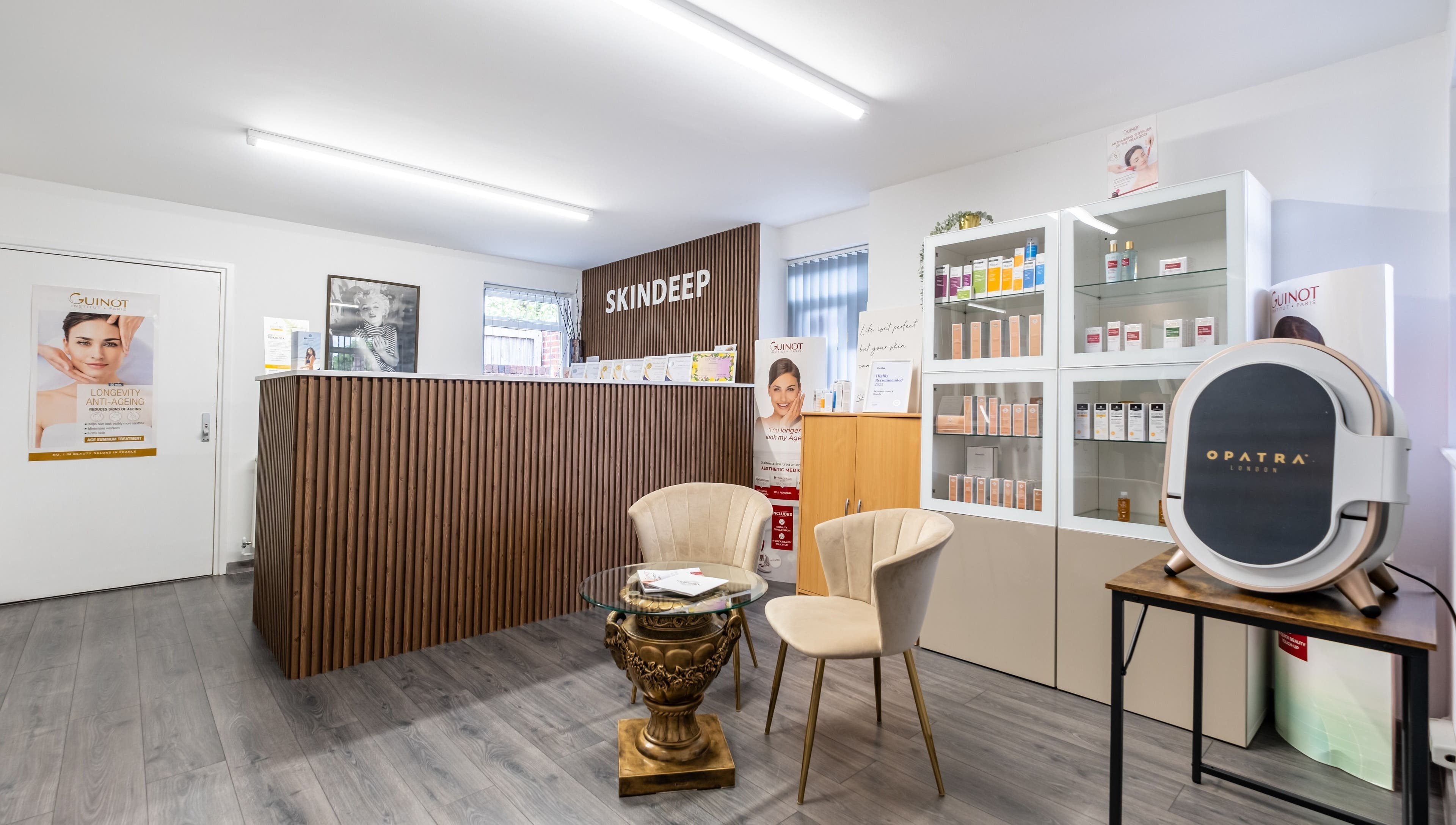 Modern reception area of Skindeep Laser & Beauty in Coventry, England, GB, featuring stylish decor and product displays.