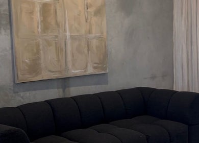 Elegant black sofa and abstract artwork at Pause, Byron Bay, New South Wales, AU.