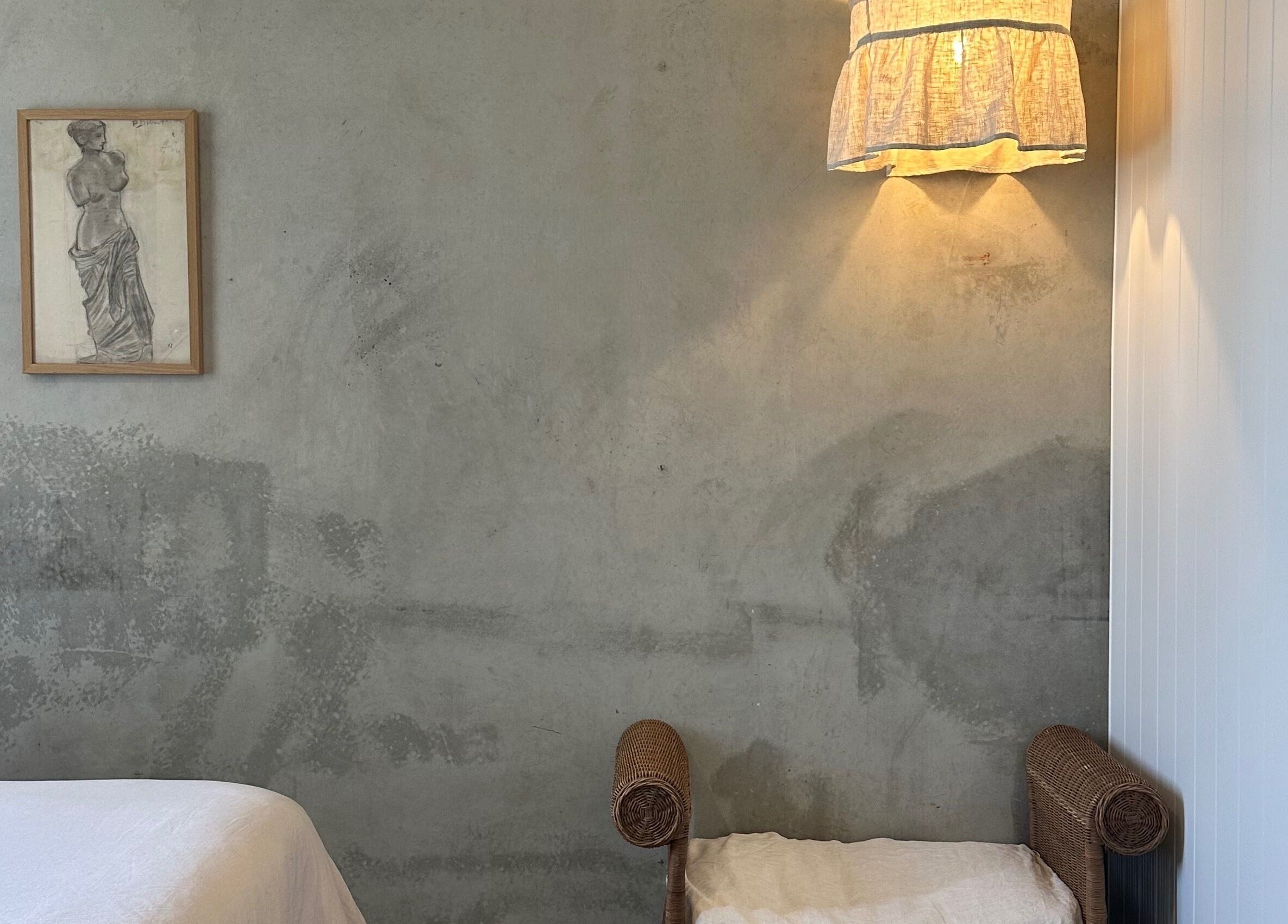 Calm therapy room at Pause, Byron Bay, New South Wales, AU with elegant wall decor and soft lighting.