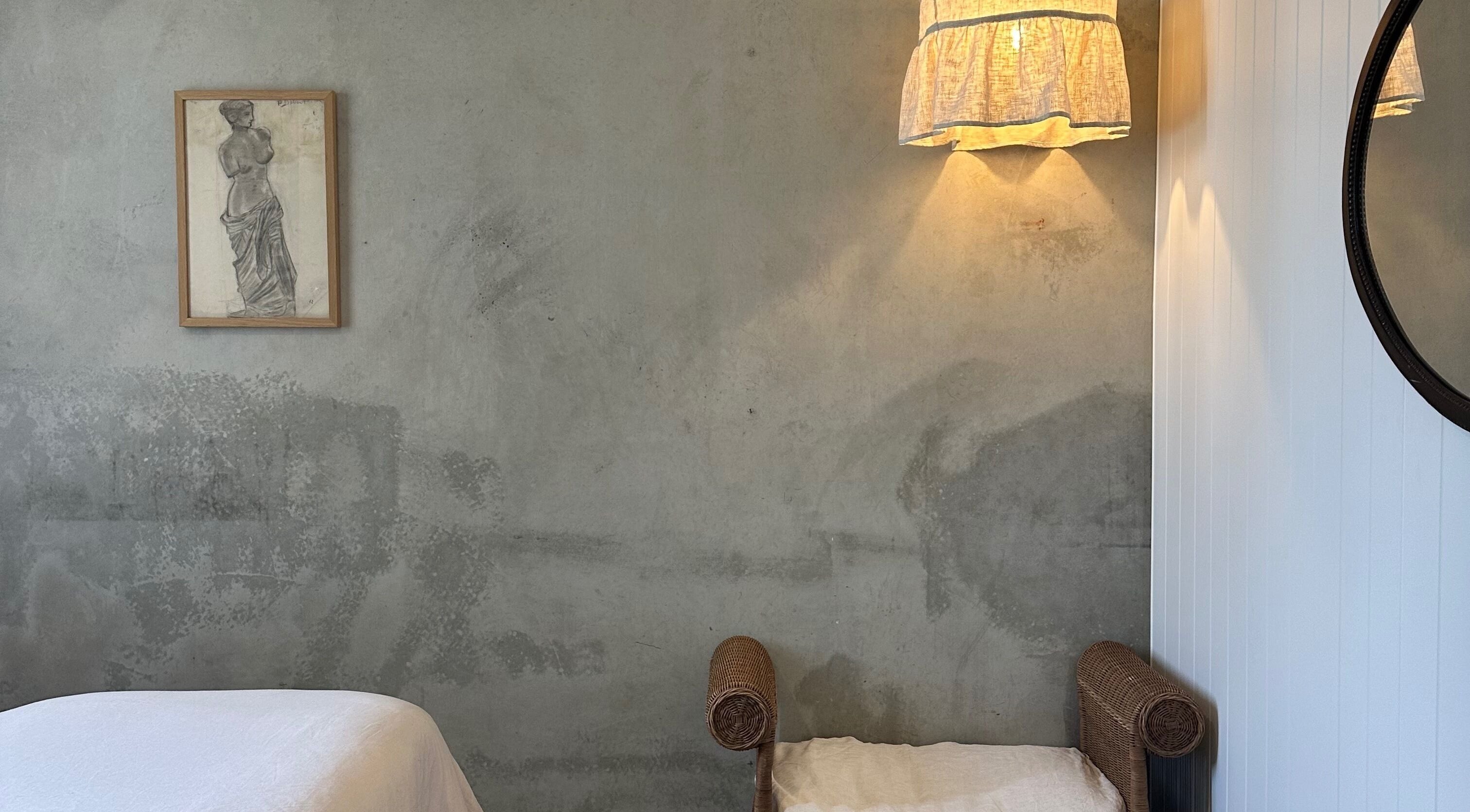 Calm therapy room at Pause, Byron Bay, New South Wales, AU with elegant wall decor and soft lighting.