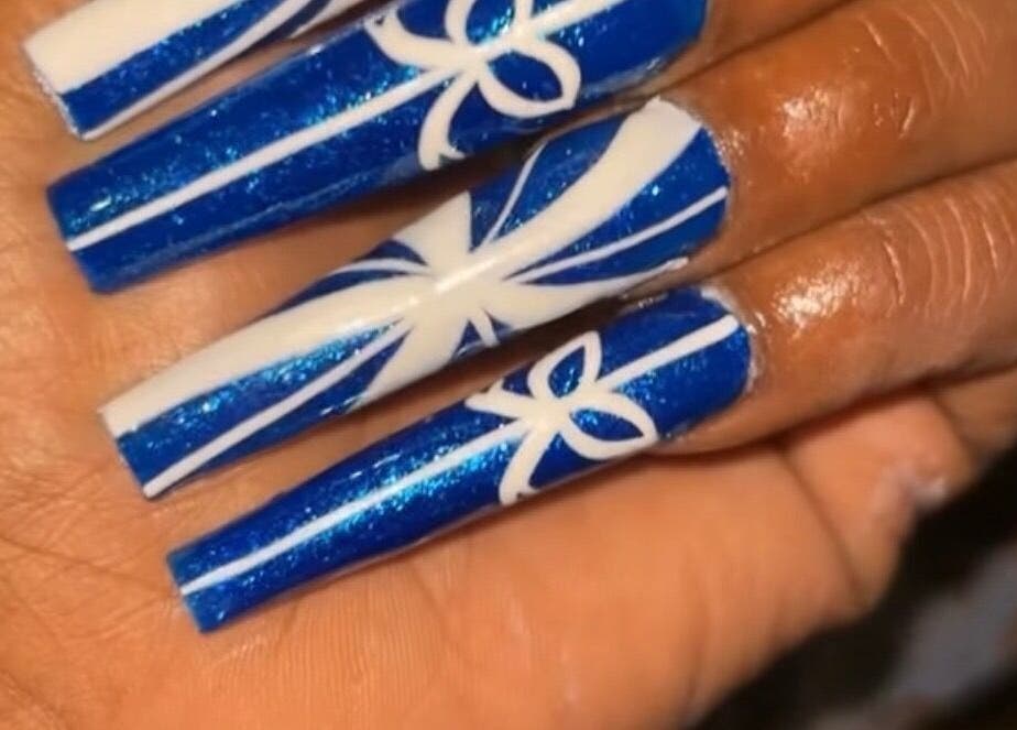 Intricate blue and white nail art at Nailzbyari, Columbus, Ohio, US.
