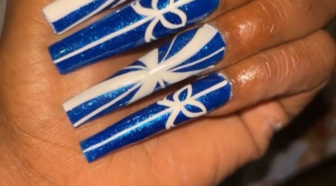 Intricate blue and white nail art at Nailzbyari, Columbus, Ohio, US.