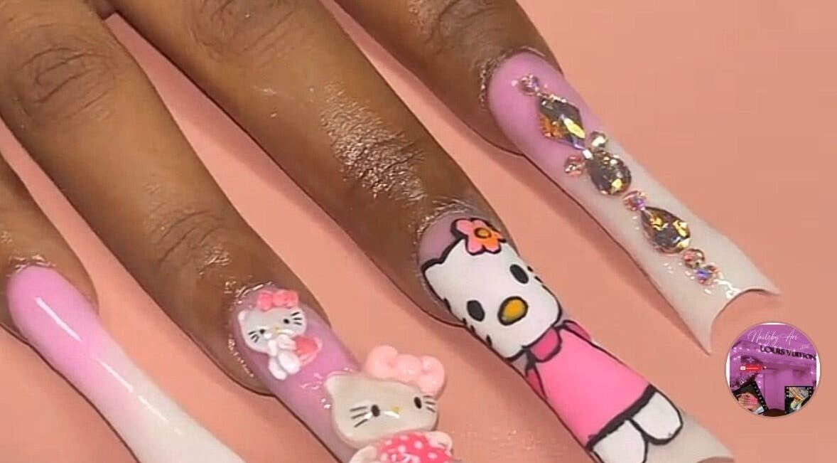 Hello Kitty nail art with 3D designs at Nailzbyari in Columbus, Ohio, US, showcasing creativity and style.