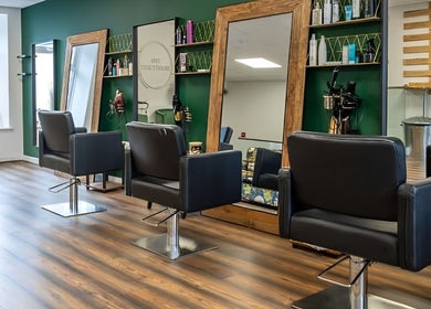 Sleek salon chairs and mirrors at The Beauty Hut Pontyclun, Pontyclun, Wales, GB, showcasing a modern aesthetic.