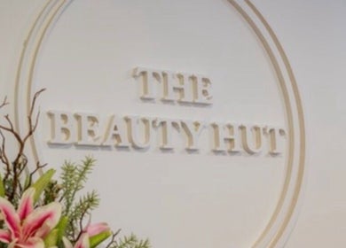 The Beauty Hut Pontyclun logo with floral decor, Pontyclun, Wales, GB.