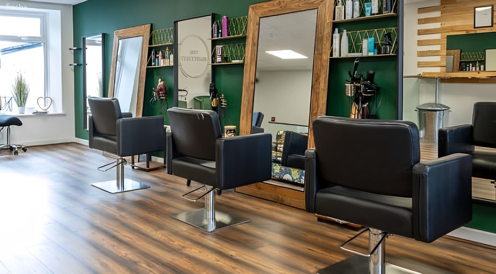 Elegant interior of The Beauty Hut Pontyclun, featuring stylish chairs and mirrors in Pontyclun, Wales, GB.