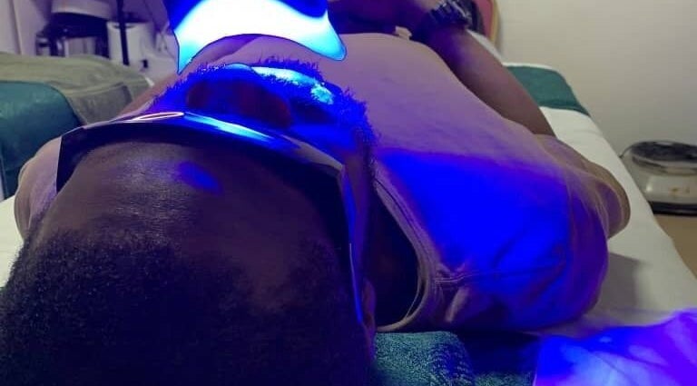 Person receiving LED therapy at Minderswarm Spa, Lekki, Lagos, NG, enjoying a rejuvenating wellness experience.
