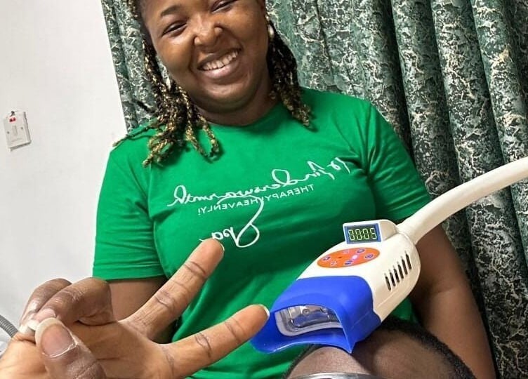 Therapist smiling during treatment at Minderswarmth Spa in Lekki, Lagos, NG, offering a warm and welcoming experience.