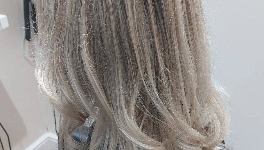 Stylish blonde hairstyle at Bare Hair and MoonFlower Holistics, Oughterby, England, GB.
