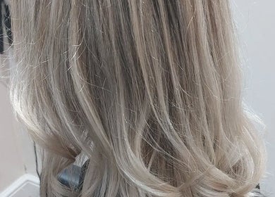 Stylish blonde hairstyle at Bare Hair and MoonFlower Holistics, Oughterby, England, GB.