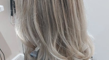 Stylish blonde hairstyle at Bare Hair and MoonFlower Holistics, Oughterby, England, GB.