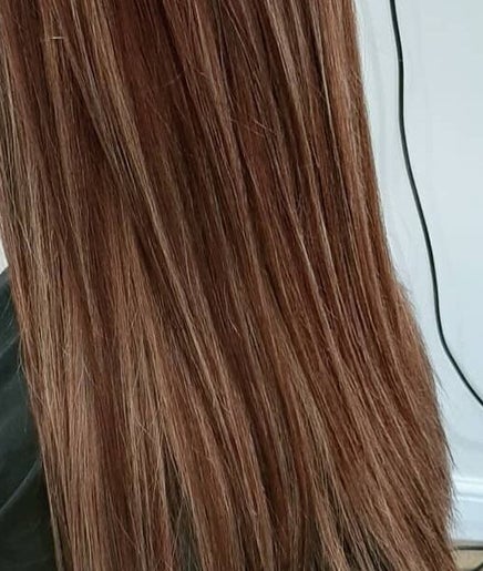 Smooth, straight brown hair at Bare Hair and MoonFlower Holistics in Oughterby, England, GB.
