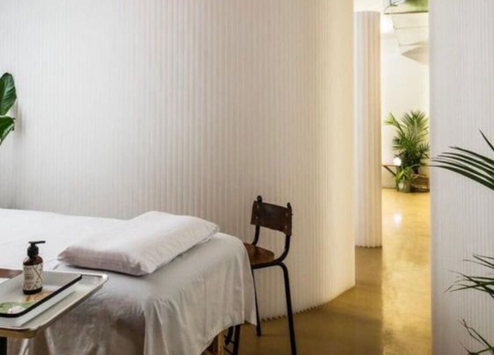 Massage room at Note To Self Wellness, Philadelphia, Pennsylvania, US, with a serene, minimalist design.