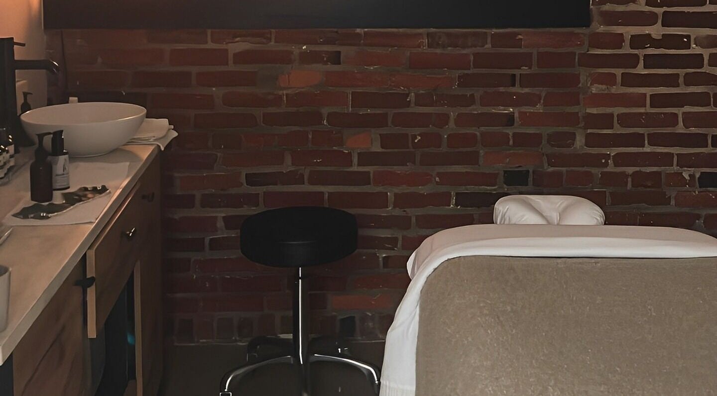 Cozy massage room at Note To Self Wellness, Philadelphia, Pennsylvania, US with warm lighting and relaxing ambiance.