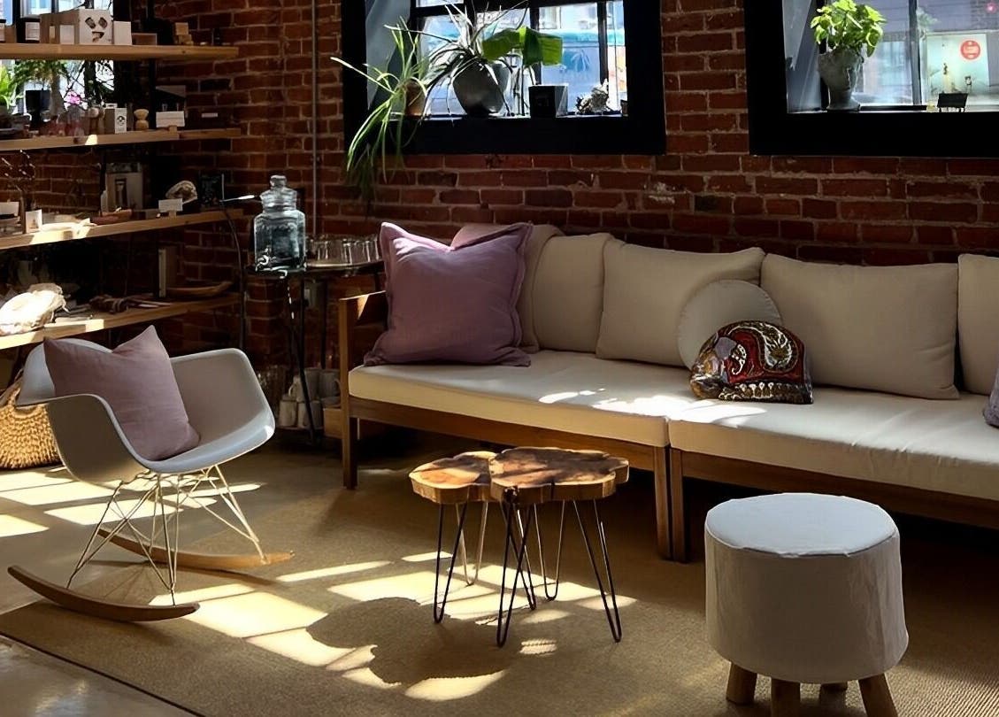 Inviting lounge at Note To Self Wellness, Philadelphia, Pennsylvania, US, with comfy seating and warm decor.
