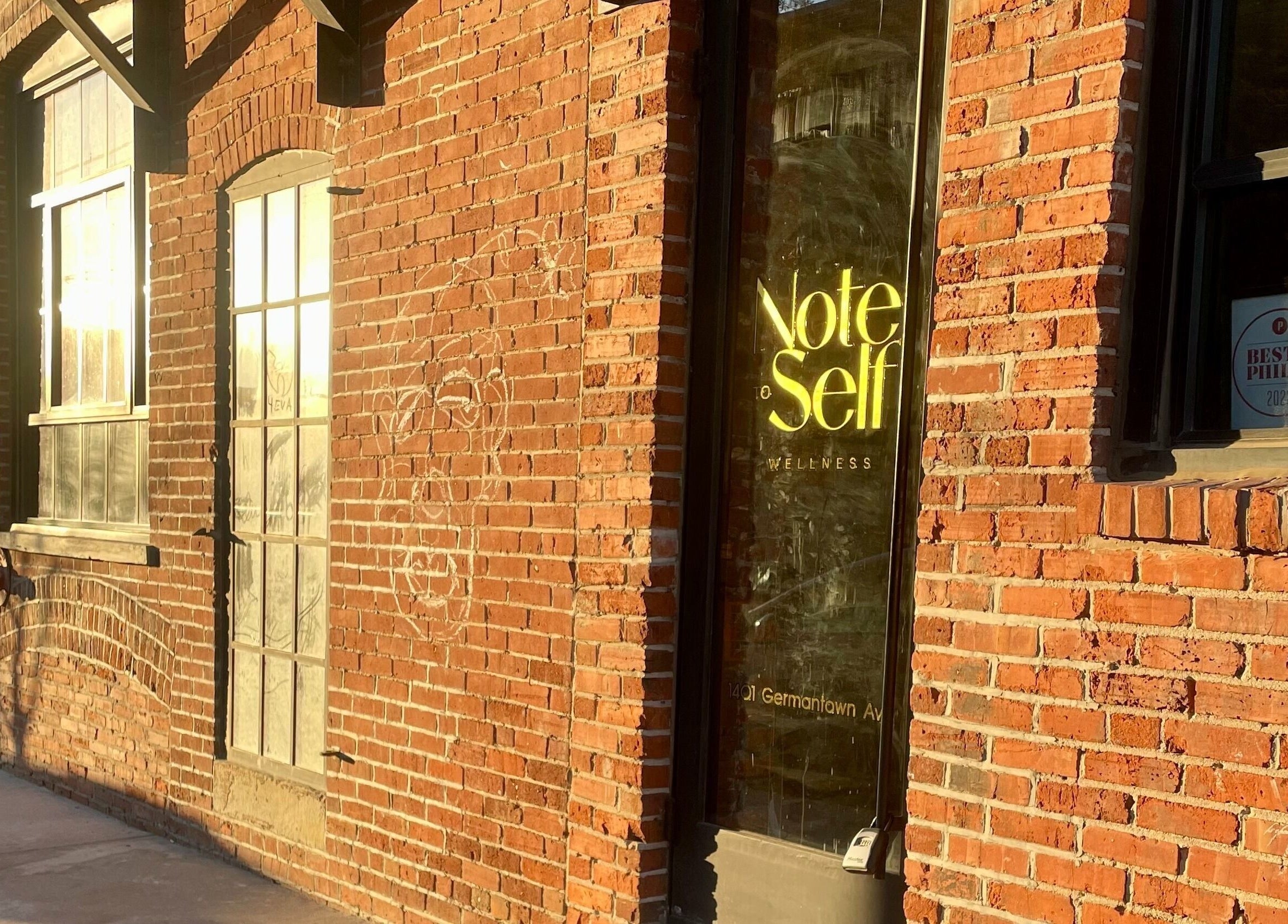 Exterior of Note To Self Wellness, brick facade, in Philadelphia, Pennsylvania, US.