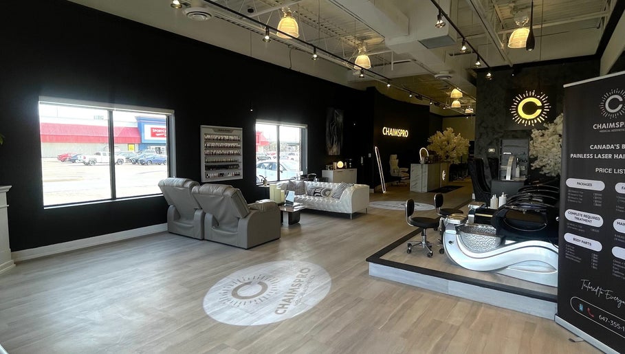 Interior of ChaimsPro Medical Aesthetics in Pickering, Ontario featuring elegant seating and modern decor.