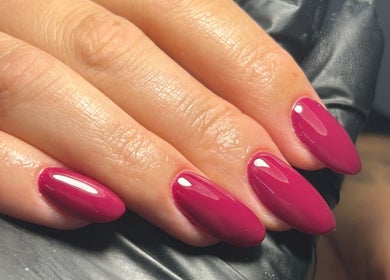 Close-up of plum manicured nails at Shanice Marie Beauty in Taunton, England, GB. Stylish nail treatment.