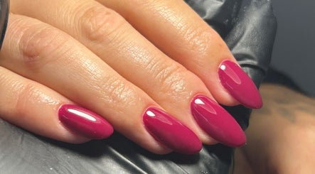 Close-up of plum manicured nails at Shanice Marie Beauty in Taunton, England, GB. Stylish nail treatment.