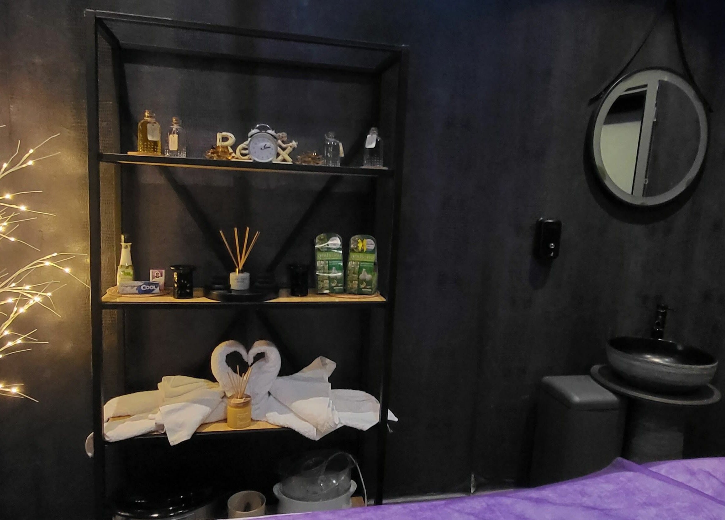 Elegant spa room at Ella Vera Lounge Spa in Al Ain, AE, with ambient lighting and luxurious decor.
