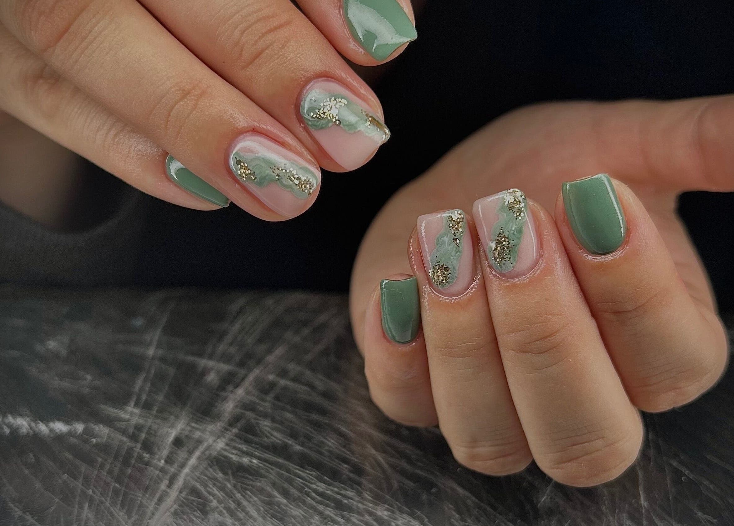 Elegant green nail art with gold accents at Pure Nail Care & Waxing, Cape Town, Western Cape, ZA.