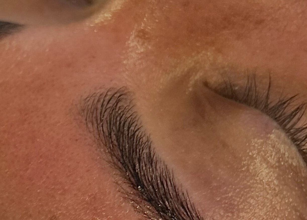 Closeup of expertly shaped eyebrows and lashes at Pure Nail Care & Waxing, Cape Town, Western Cape, ZA.