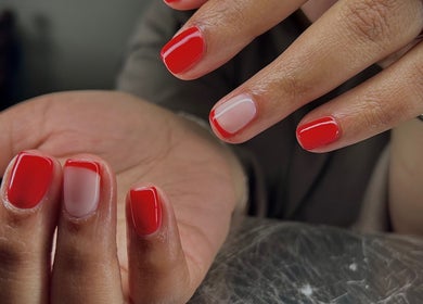 Vibrant red manicure at Pure Nail Care & Waxing in Cape Town, Western Cape, ZA, highlighting glossy nail finish.
