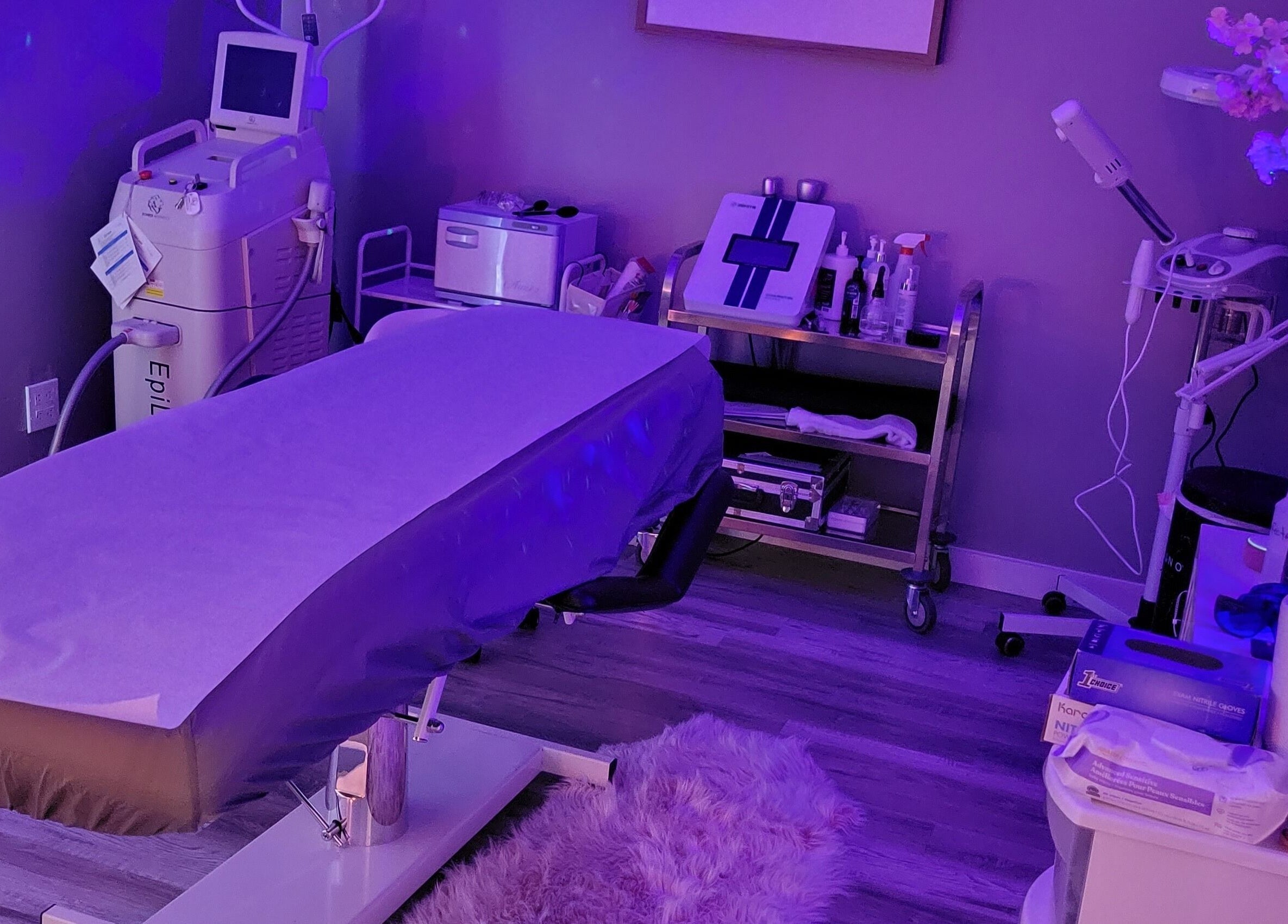 A tranquil treatment room at Elemental Aesthetics, Mahopac, New York, US, featuring a spa bed and equipment.