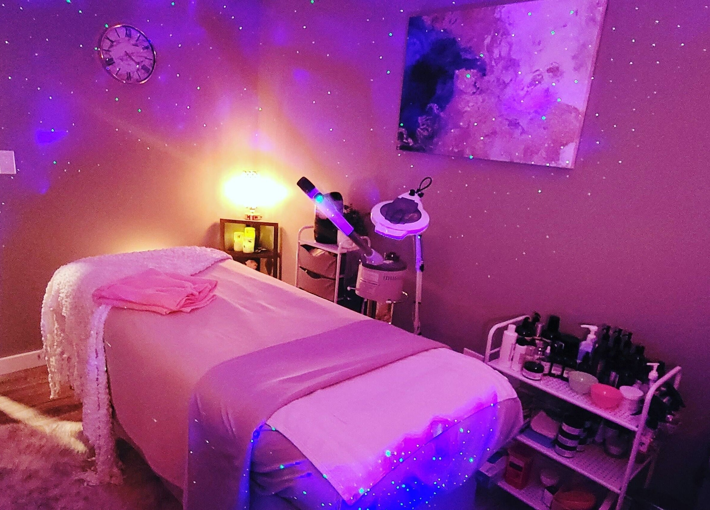 Tranquil spa room at Elemental Aesthetics in Mahopac, New York, US with soothing purple lighting.