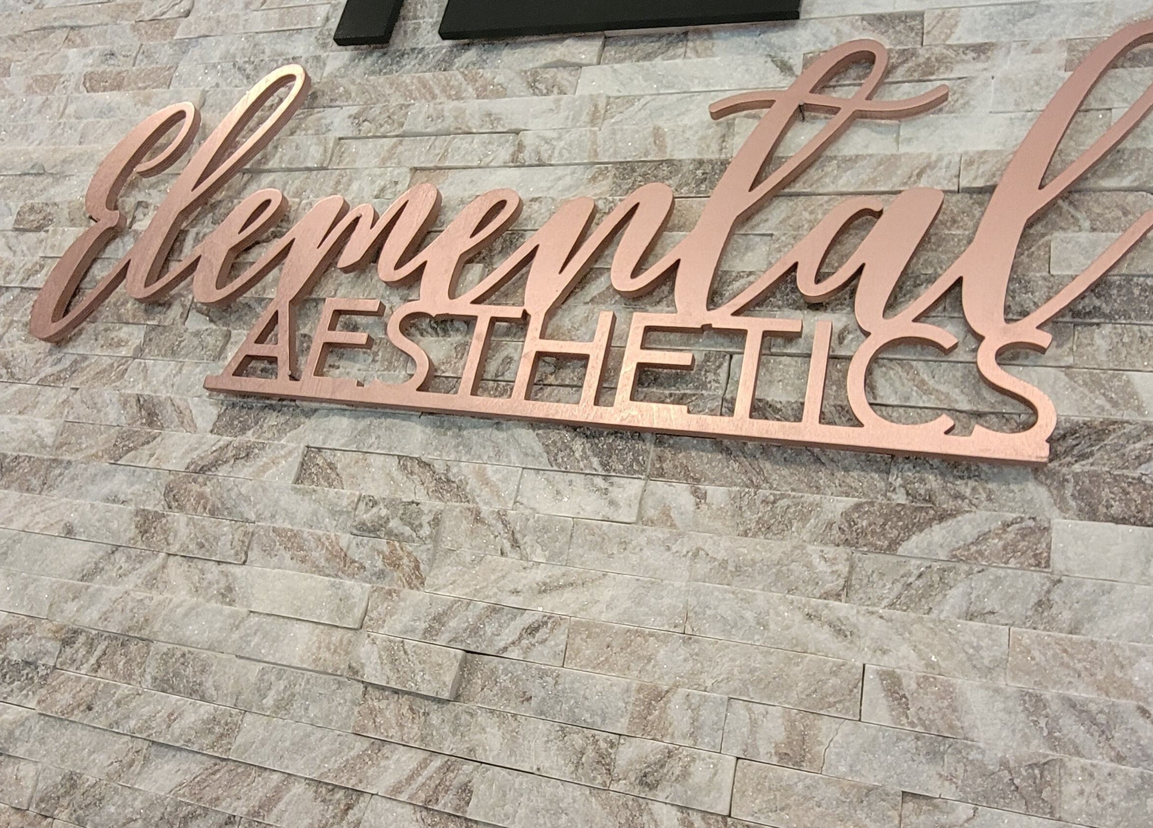 Elemental Aesthetics wall sign in Mahopac, New York, US.