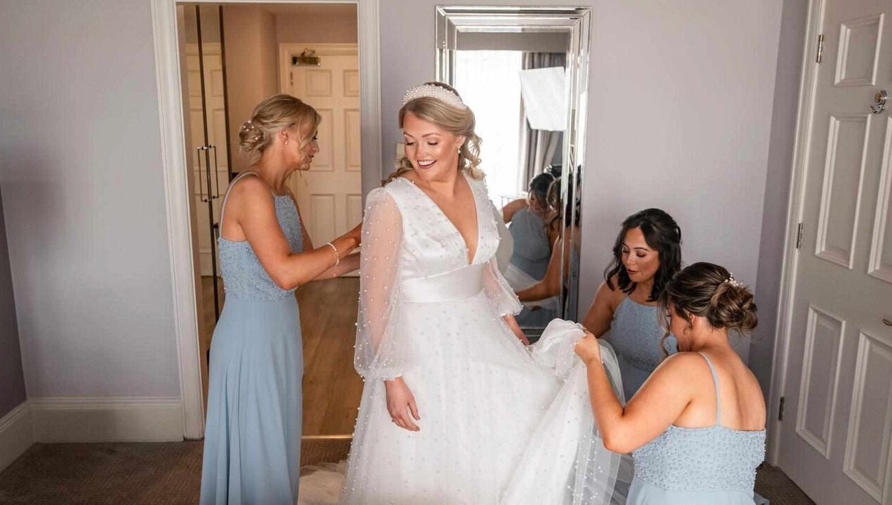 Bride getting ready with bridesmaids at Helen Mcclurg Make Up Artist, Ballywalter, Northern Ireland, GB.