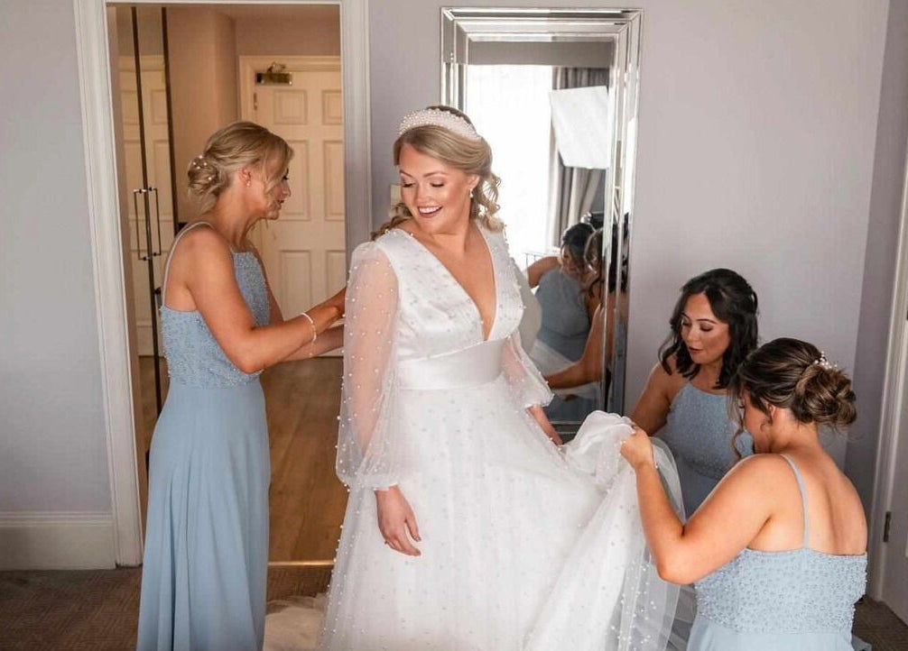Bride getting ready with bridesmaids at Helen Mcclurg Make Up Artist, Ballywalter, Northern Ireland, GB.
