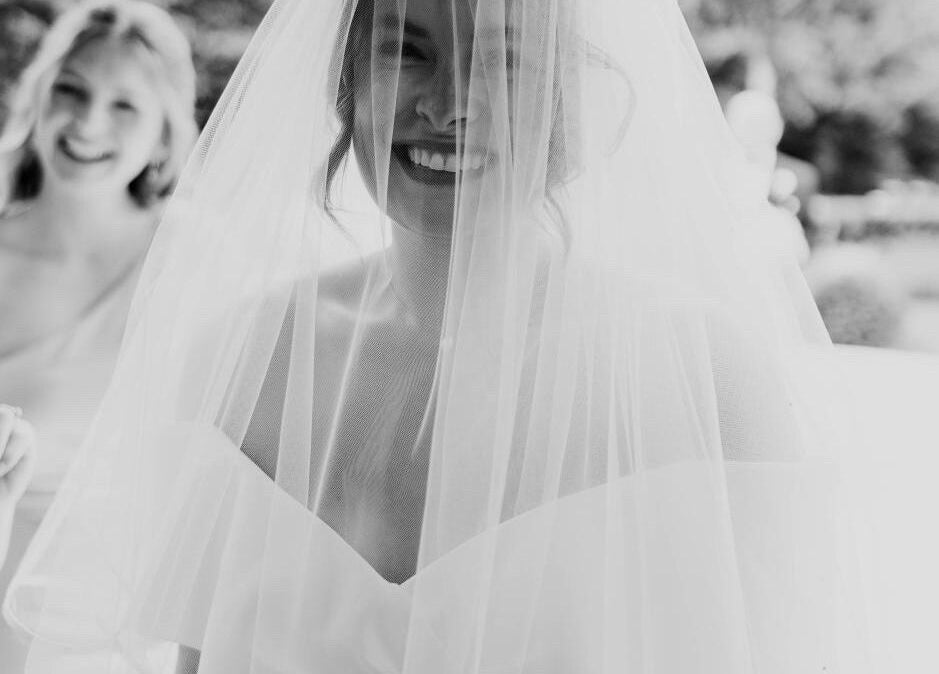Bride smiling under veil at Helen Mcclurg Make Up Artist, Ballywalter, Northern Ireland, GB.